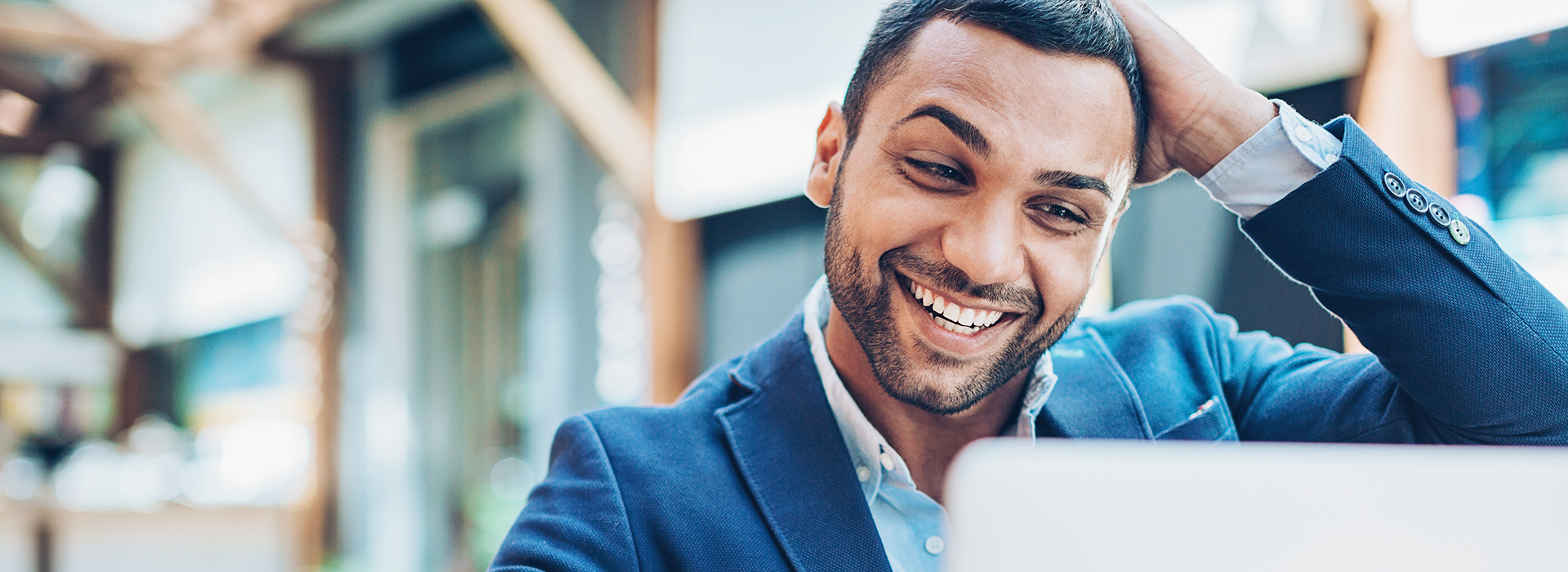 Excited Man looking at Computer